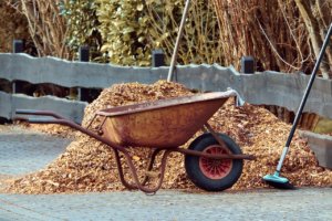 a picture of a wheelbarrow full of mulch