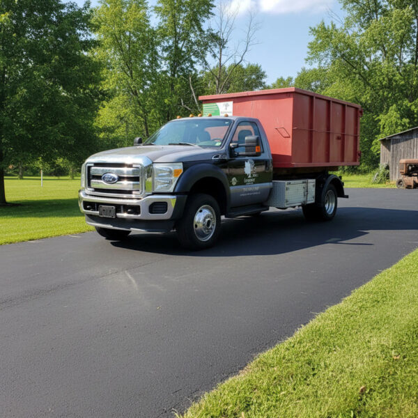 image of Greenmarc Gardens delivery truck with a red bin on the back